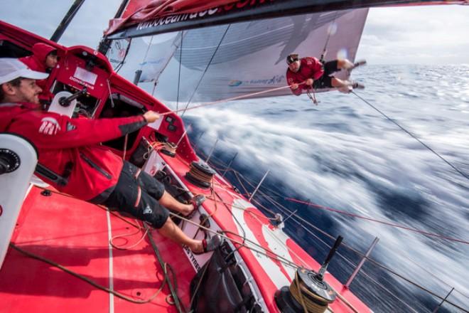 Dongfeng Race Team - Kevin Escoffier is done checking the leech line so Thomas Rouxel pulls him in - Leg 4 to Auckland -  Volvo Ocean Race 2015 © Sam Greenfield/Dongfeng Race Team/Volvo Ocean Race